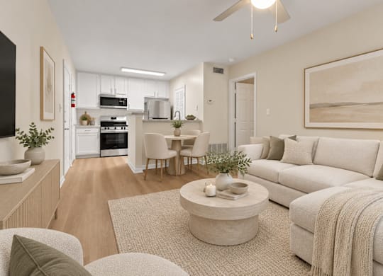 Open floor plan living area with modern kitchen at The Courts at Fair Oaks Apartments, Fairfax