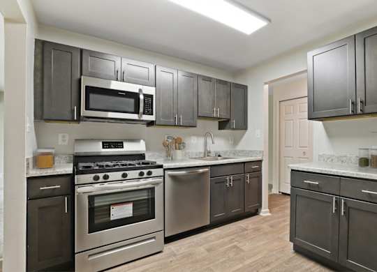 Kitchen With White Cabinetry And Appliances at Annapolis Roads, Annapolis, MD