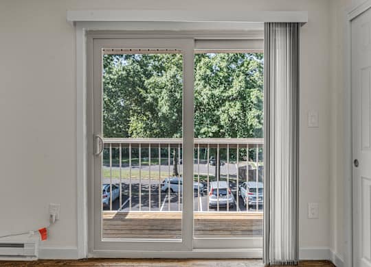 Room with Glass Doors at Atlantic Pointe Apartments, Atlantic Highlands