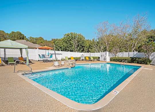 Swimming Pool with sitting area at Arbors at Natchez Trace Apartments, Ridgeland, MS