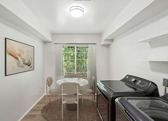 A laundry room with a washer and dryer.