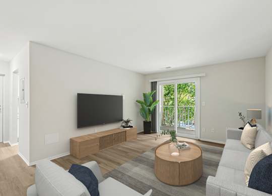 A living room with a white couch, a wooden coffee table, and a flat screen TV.