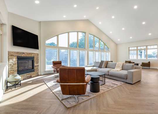 a living room with a couch and a chair and a fireplace at Copper and Quarry Village, Maryland, 21209