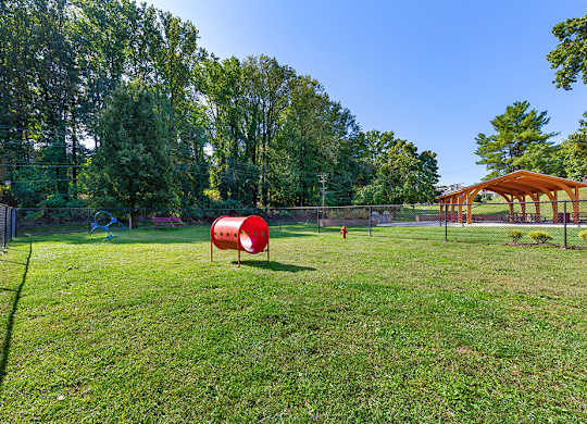 a park with a playground and a swing set at Copper and Quarry Village, Maryland, 21209