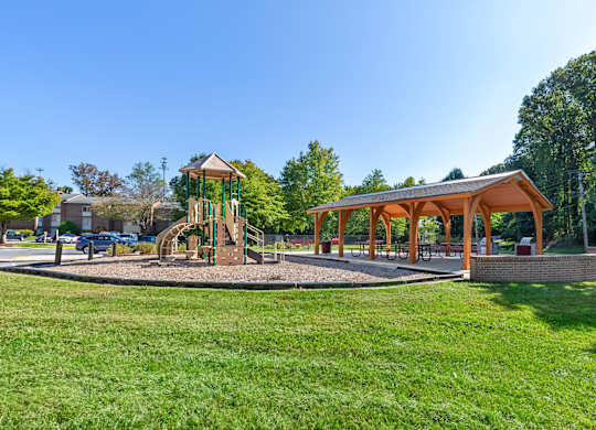 a park with a playground and a pavilion at Copper and Quarry Village, Pikesville, 21209