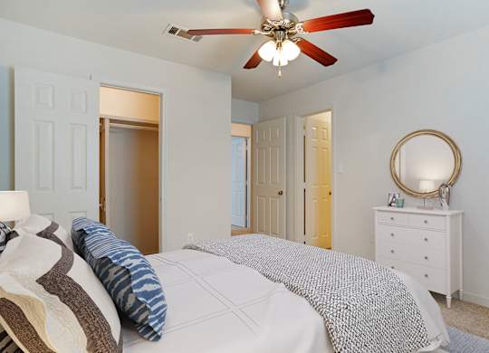 Bedroom with cozy bed at Crosswinds Apartments, Pearl, 39208