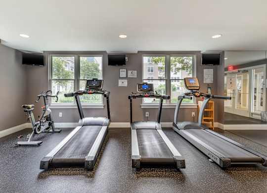 Fitness room with treadmills and spin bike at Pier Village Apartments, Long Branch, New Jersey