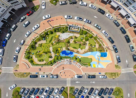 Aerial view of circular mini golf course with parking at Pier Village Apartments, Long Branch
