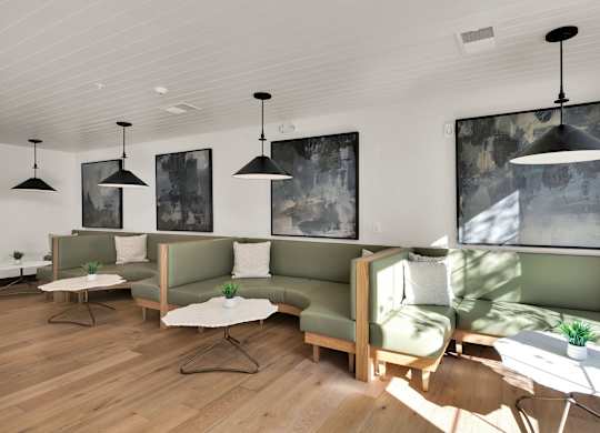A Clubhouse with Green Couch at District 757 Apartments, Virginia