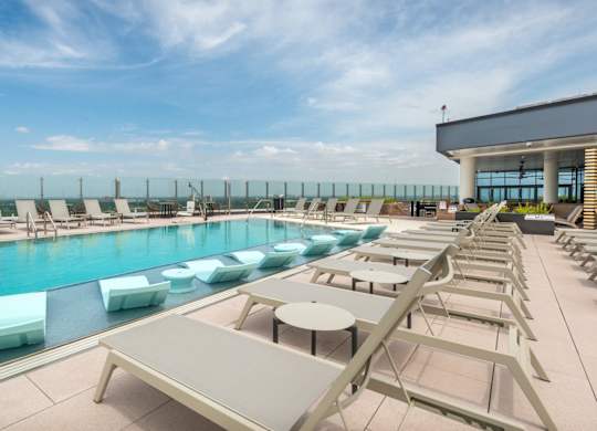 Swimming Pool with Sun Loungers at Eastline Residences Apartments, Dallas, TX, 75206