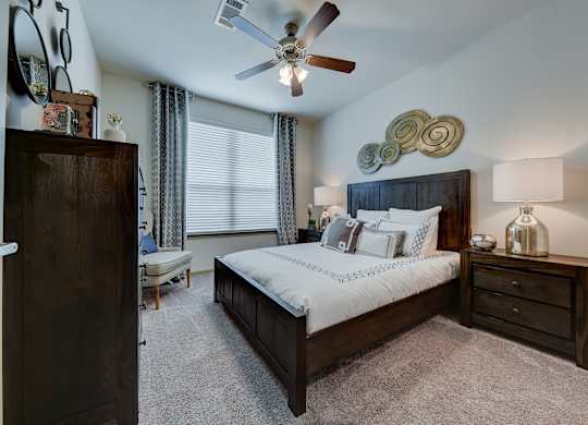 Bedroom with cozy bed at Estraya Westover Hills, San Antonio, TX