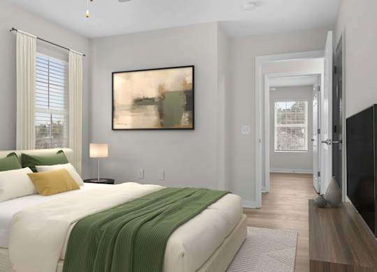 A bedroom with a large bed and a painting on the wall at Grand at Pearl Apartments, Pearl, MS 39208