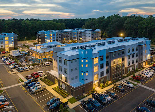 Exterior area at night at Lumen Apartments, Hampton, 23666