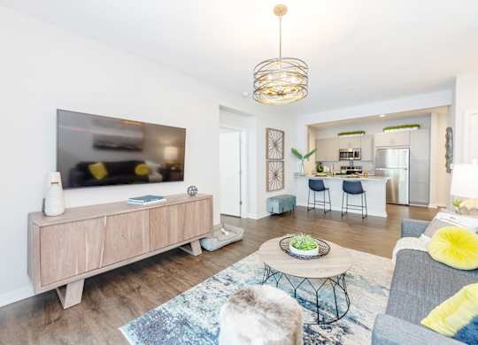 Living room with tv, couch at Lumen Apartments, Virginia