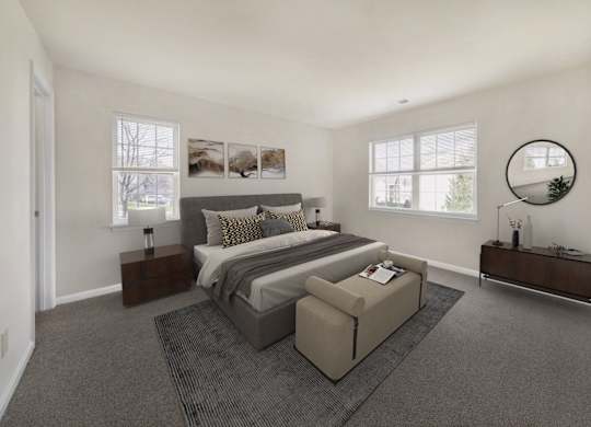 Bedroom with cozy bed and window at The Apartments at Owings Run, Owings Mills, 21117