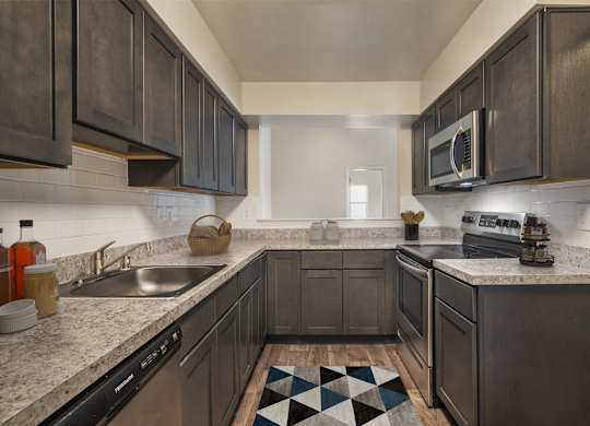 Kitchen with mosaic tiles at The Apartments at Owings Run, Maryland