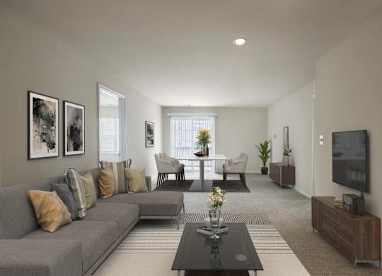 Living room with couch at The Apartments at Owings Run, Maryland, 21117