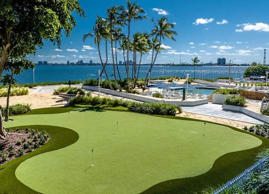 a rendering of a park with palm trees and a body of water at The Hamilton, Miami, FL