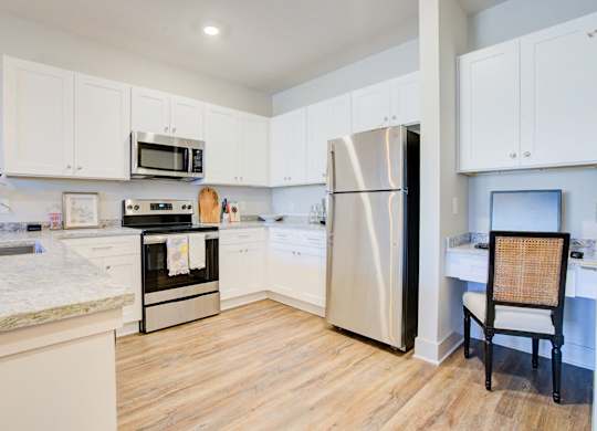 Kitchen with Stainless Steel Refrigerator at Midtown Row Apartments, Montgomery, AL, 36106