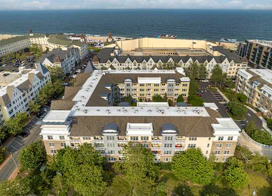 Aerial view of oceanfront residential community with courtyard at Pier Village Apartments, Long Branch, 7740