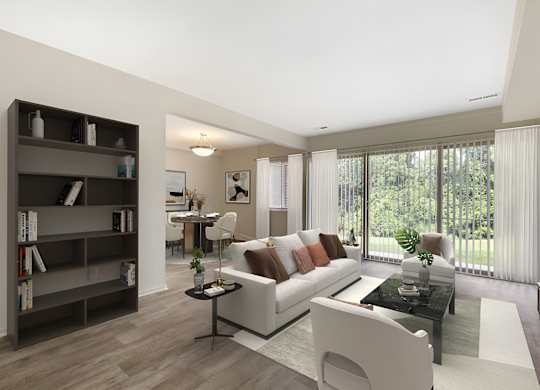 a living room filled with furniture and a large window at Copper and Quarry Village, Pikesville, MD