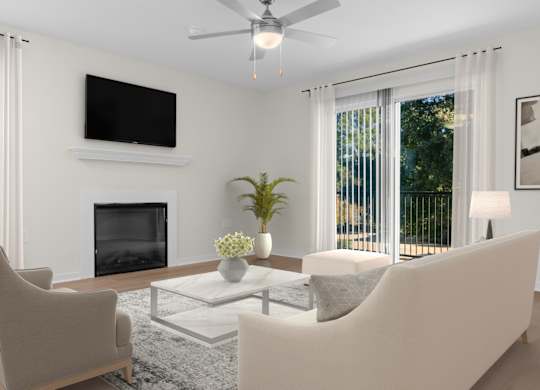 A living room with a fireplace, two chairs, a sofa, and a television. at Reflection Pointe, Mississippi