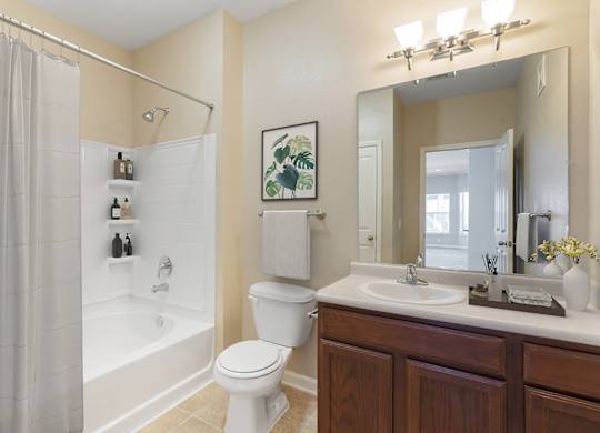 Bathroom with toilet at Reflections of Island Park Apartments, Shreveport, Louisiana