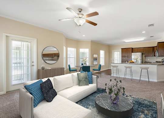 Living room with couch at Reflections of Island Park Apartments, Louisiana