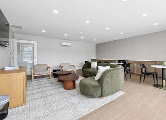 A spacious waiting room with a variety of seating options and a reception desk.