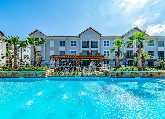Pool front view at Stone Loch Apartments, Tomball, TX