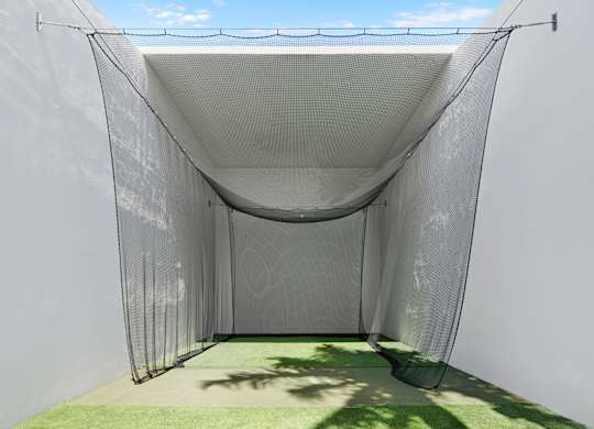 Golf practice net in outdoor enclosure at The Hamilton Apartments, Miami, FL 33137
