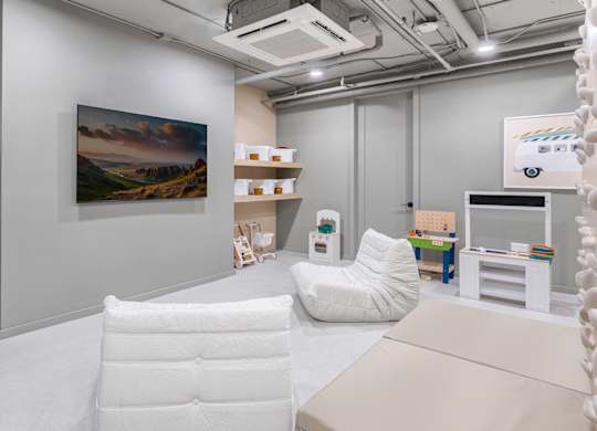 Childrens playroom with soft seating and toys at The Hamilton Apartments, Miami, FL