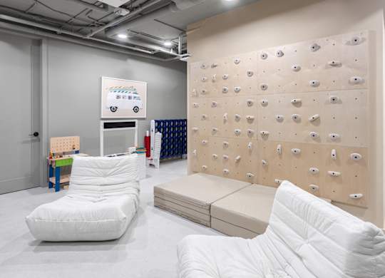 Indoor rock climbing wall with foam mats at The Hamilton Apartments, Miami, Florida