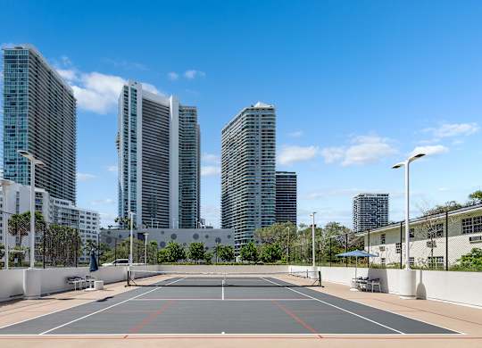 Tennis court with high rise skyline views at The Hamilton Apartments, Florida