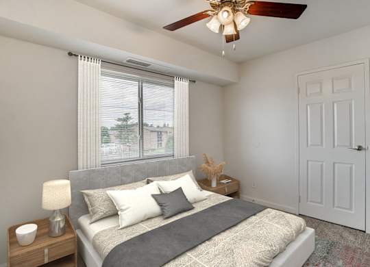A Bedroom with Nightstand at The Manor/The Manor East Apartments, Leesburg