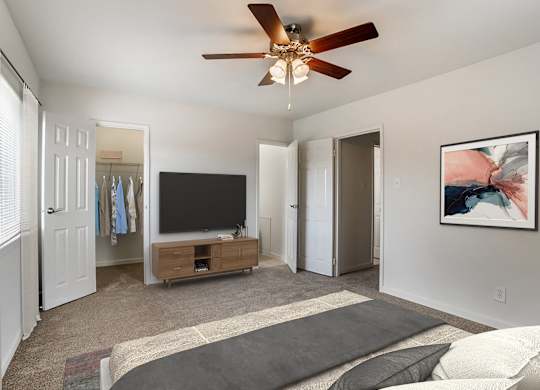A Bedroom with TV at The Manor/The Manor East Apartments, Leesburg, 20176