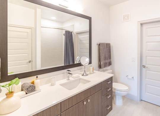Vanity in bathroom at The Rosemary Apartments, Humble, 77346