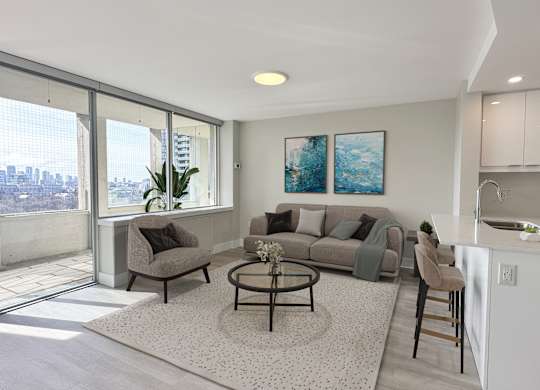 Living Space with view of balcony and open concept kitchen