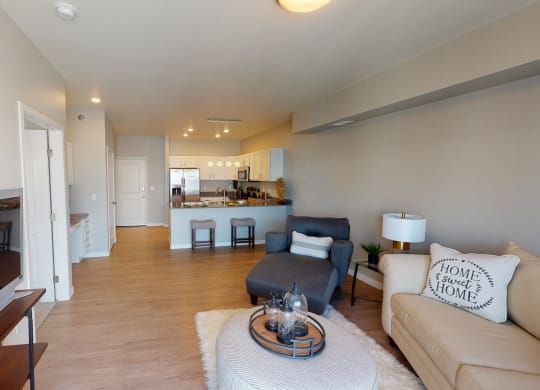 living room and kitchen at Northern Lights a Lifestyle-Driven Community, West Fargo