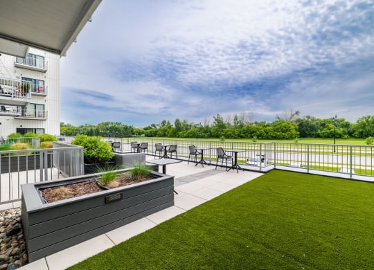 the preserve at ballantyne commons apartment balcony and grassat Northern Lights a Lifestyle-Driven Community, West Fargo, 58078