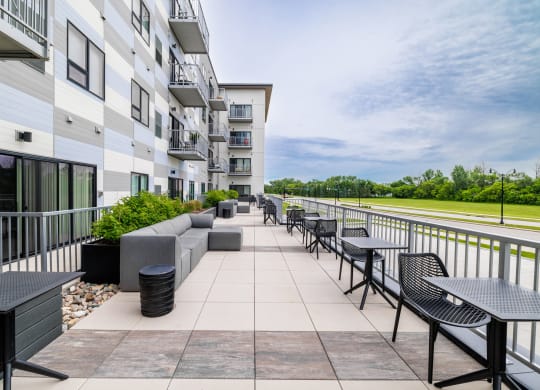 the preserve at ballantyne commons community patio with tables and chairsat Northern Lights a Lifestyle-Driven Community, West Fargo, 58078