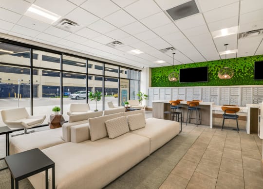 a rendering of a living room with a white couch and tables at Northern Lights a Lifestyle-Driven Community, West Fargo, North Dakota