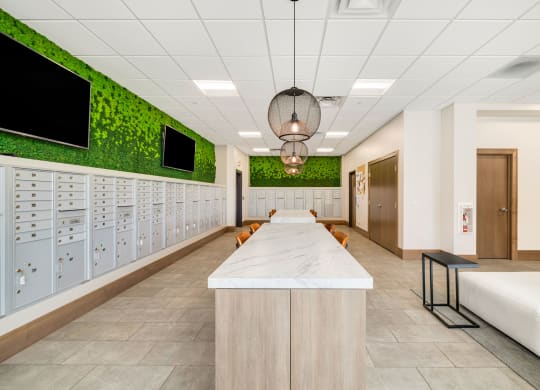 a locker room in a hospital with a long counter and a row of lockers at Northern Lights a Lifestyle-Driven Community, West Fargo, 58078