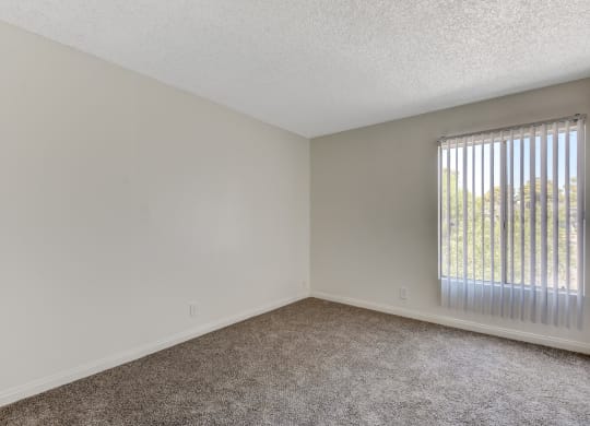 Empty Bedroom with large windows at Summer Meadows, Nevada, 89102