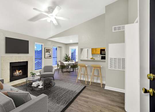 A modern living room with a fireplace and a flat screen TV. at Seacrest Apartments, Garland