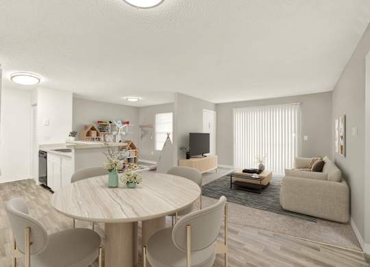 A modern living room with a dining table and chairs.