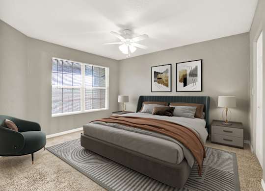 A bedroom with a large bed and a chair.