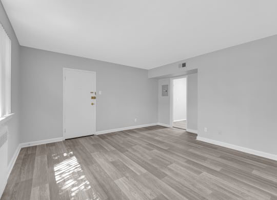a bedroom with hardwood floors at Hampton Gardens, Saint Louis, Missouri