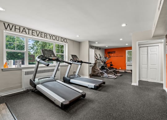 Fitness center at the enclave at woodbridge apartments in sugar land, tx