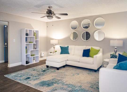 a living room with a white couch and a ceiling fan at Granite Bay, Phoenix, Arizona, 85023